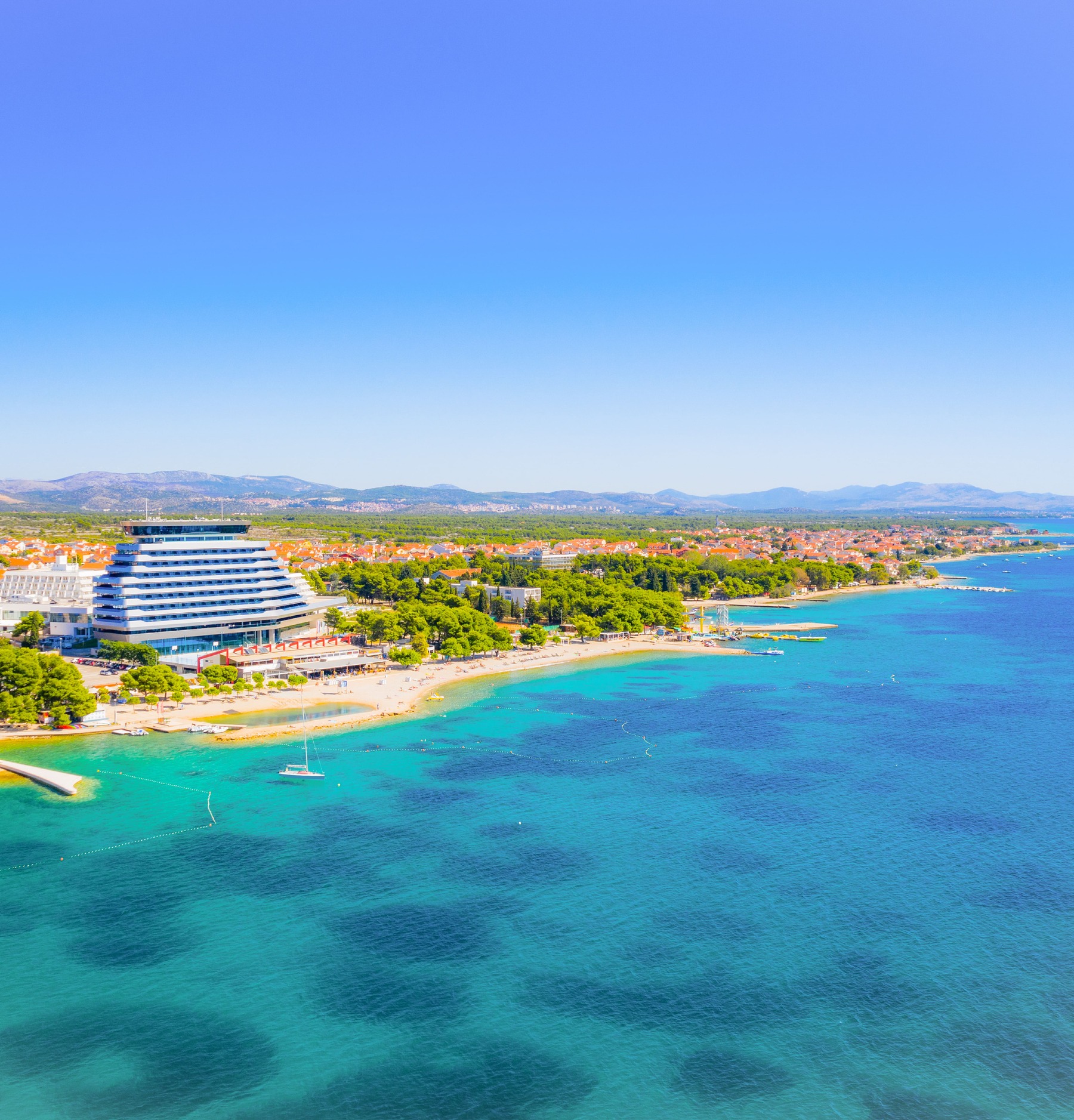 Seaside Serenity: A View over Vodice and the Olympia Hotel – 184920372 | (c) Ilijaaa | Dreamstime.com